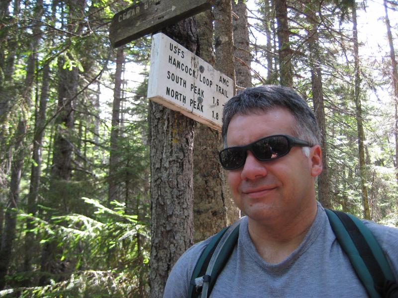 CedarBrook-d (1).JPG - Tim at the Hancock loop trail. I'd like to hike those mountains again someday.